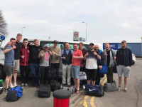 crowd of men beside taxi in Scunthorpe