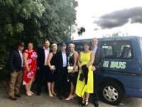 Family standing at side of Pams mini bus hire in Scunthorpe